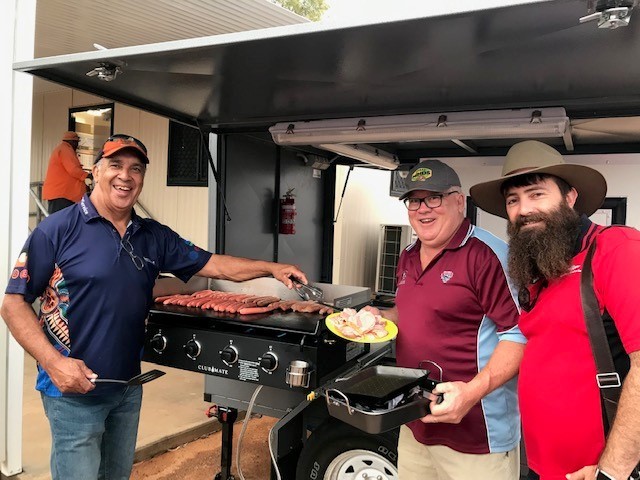 Locals of Boulia Shire enjoying a community BBQ with their new BBQ/Cold Room trailer including the Mayor Rick Britton