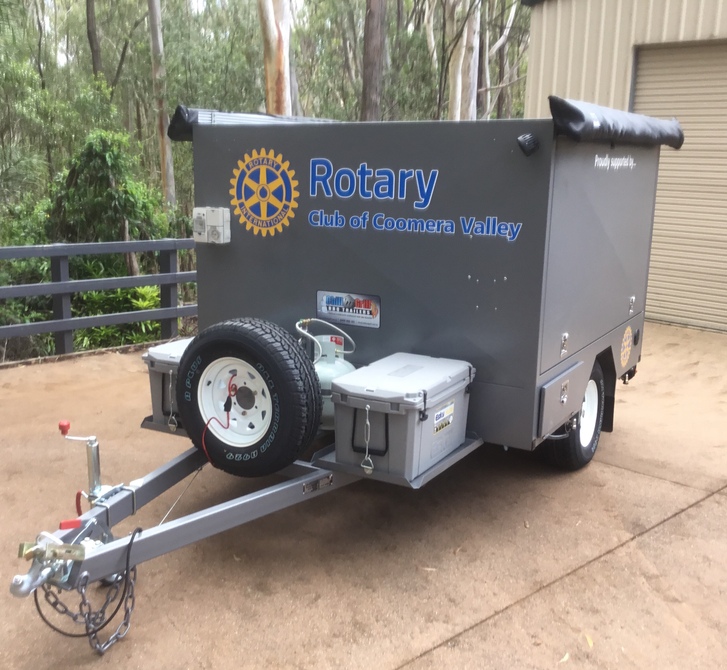 Different set up - Dual BBQs that pivot and swing out, rear door and stainless prep table, dual awnings, white and amber LED lighting and more.  This Big Bbq trailer runs on 12v and gas power!